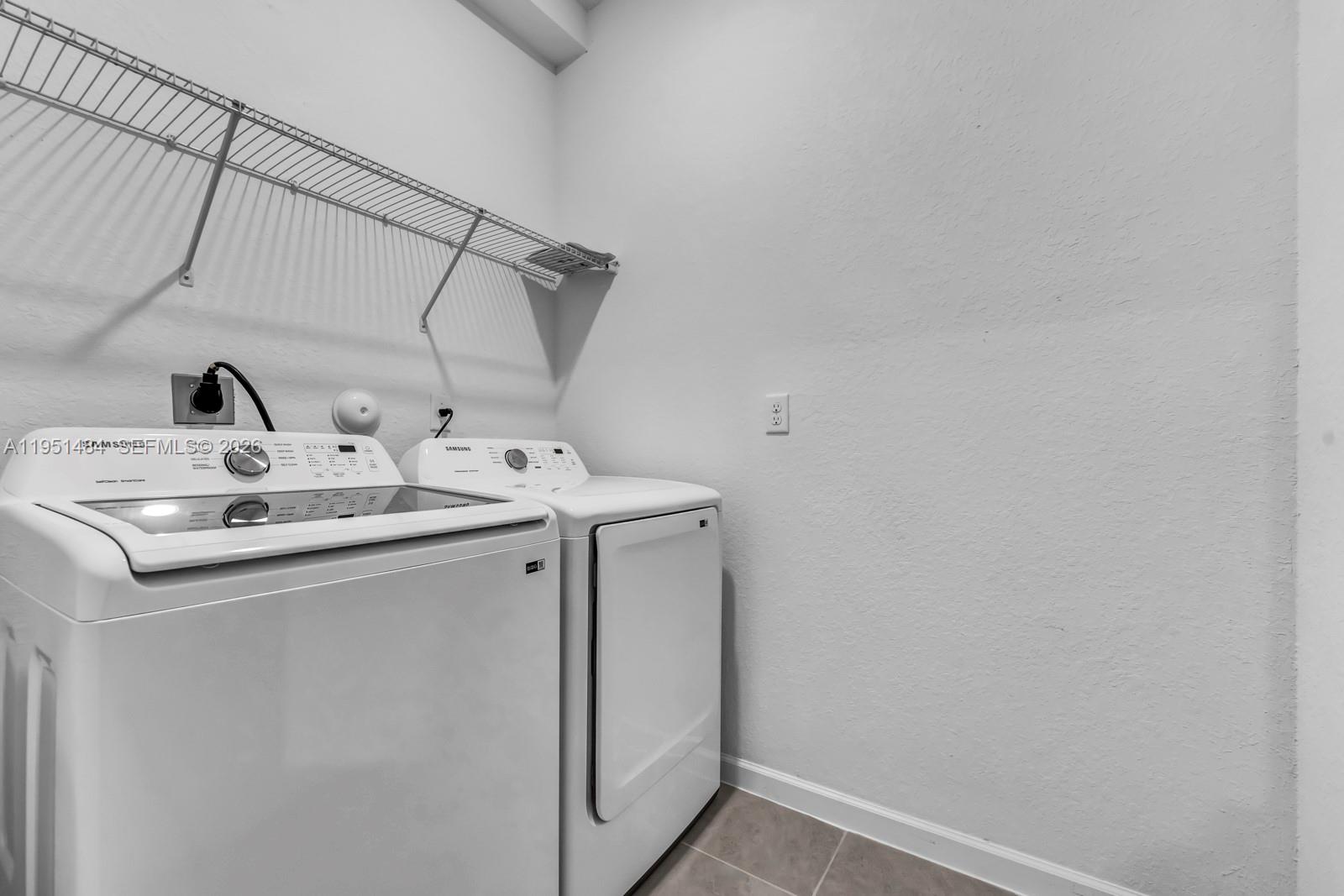 13067 Southwest 286th Street, Unit 13067 Homestead, FL 33033 - Photo 18 of 37 a utility room with dryer and washer