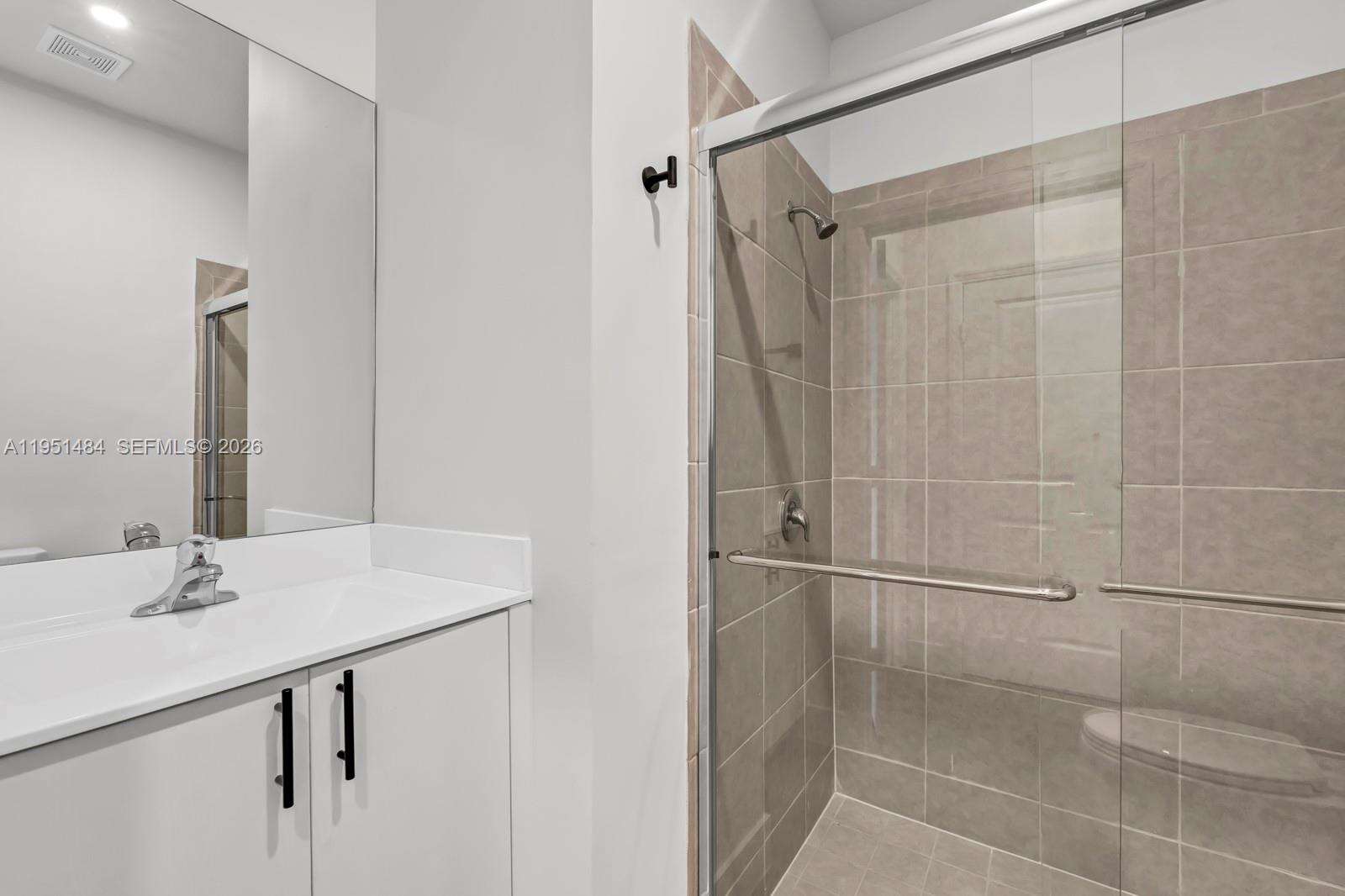 13067 Southwest 286th Street, Unit 13067 Homestead, FL 33033 - Photo 20 of 37 a bathroom with a shower and a sink