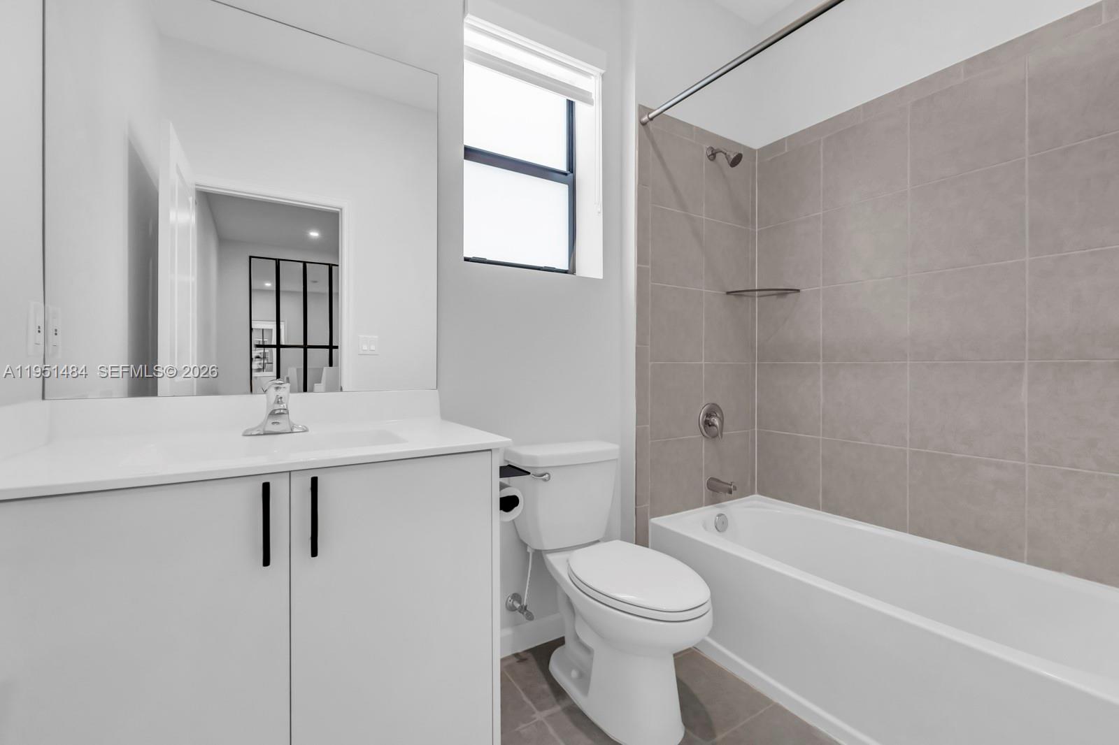 13067 Southwest 286th Street, Unit 13067 Homestead, FL 33033 - Photo 21 of 37 a bathroom with a sink a toilet and shower