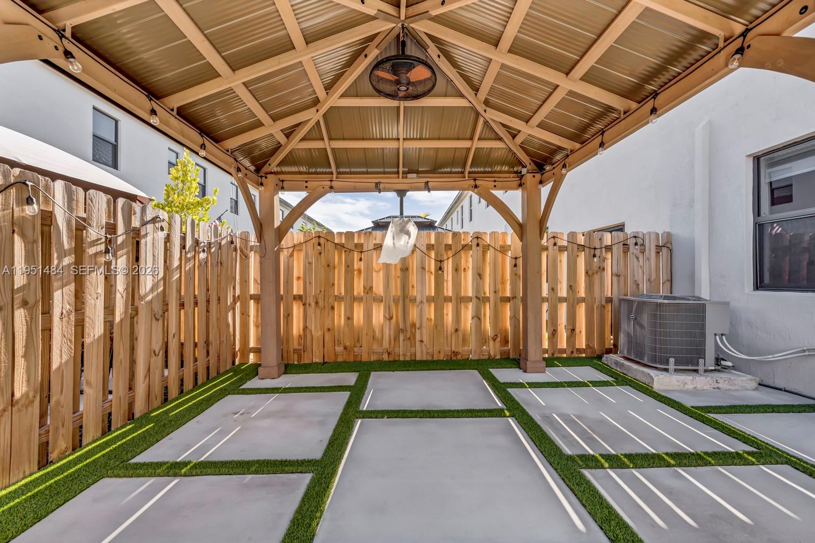 13067 Southwest 286th Street, Unit 13067 Homestead, FL 33033 - Photo 26 of 37 a view of a backyard with a tub