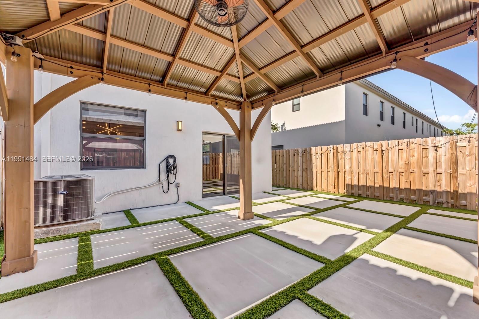 13067 Southwest 286th Street, Unit 13067 Homestead, FL 33033 - Photo 27 of 37 a living room with lots of furniture and a rug