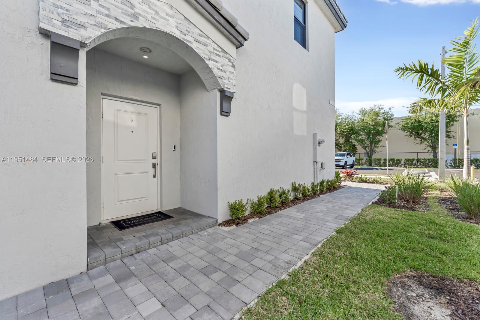 13067 Southwest 286th Street, Unit 13067 Homestead, FL 33033 - Photo 32 of 37 a view of a back yard of the house