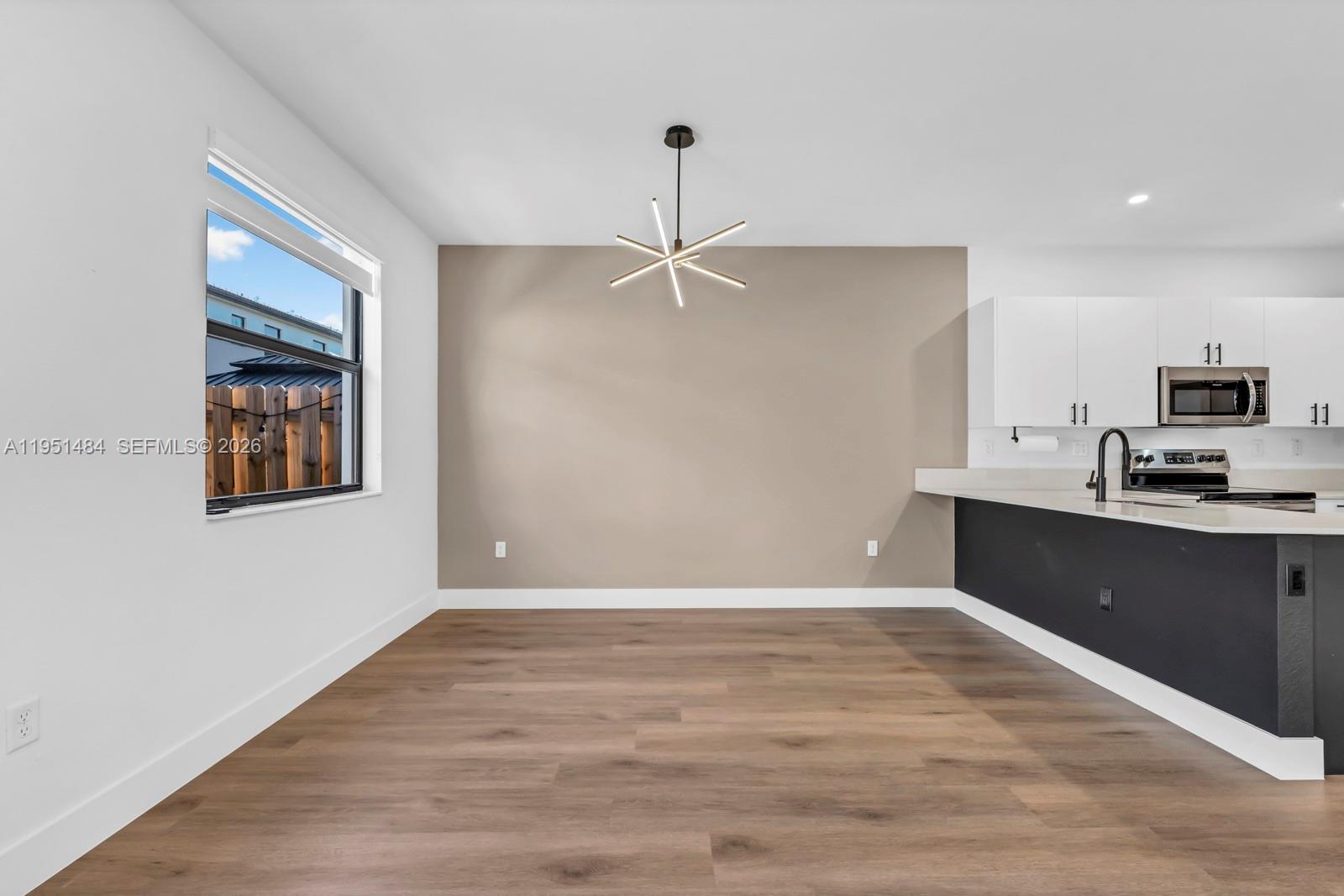 13067 Southwest 286th Street, Unit 13067 Homestead, FL 33033 - Photo 9 of 37 a view of a kitchen with a sink and dishwasher