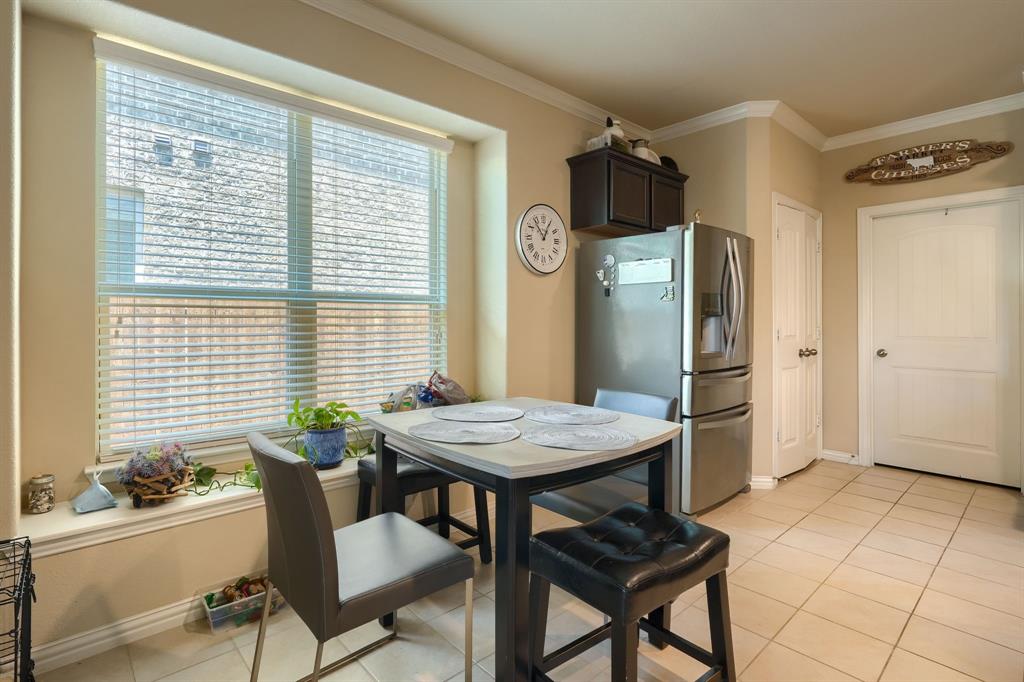 12417 Hitch Rack Way McKinney, TX 75071 - Photo 9 of 17 Dining space featuring crown molding and light tile flooring