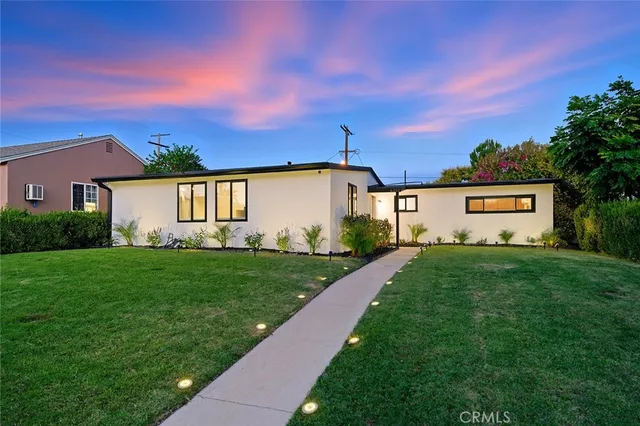 a view of a backyard with a garden