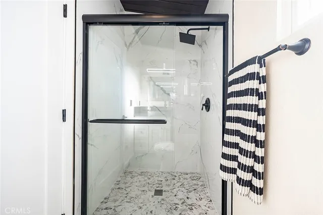 a bathroom with a shower and a sink