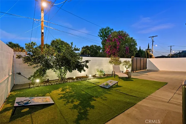 a view of a swimming pool with a yard