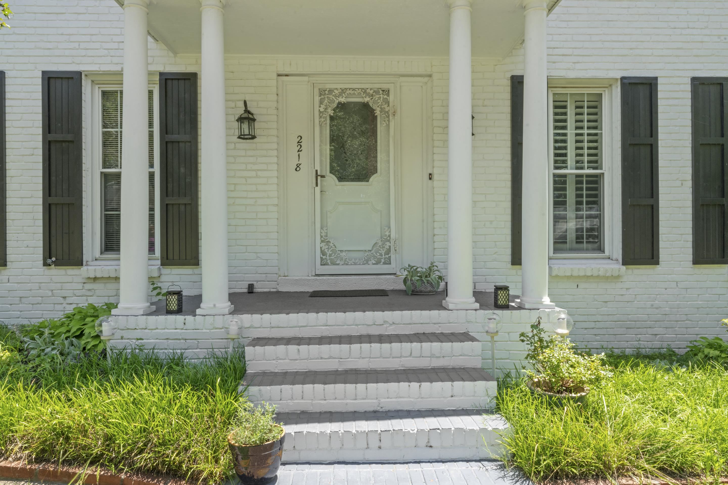 2218 Riverdale Road Germantown, TN 38138 - Photo 39 of 40 Classic Southern charm welcomes you home with stately columns, painted brick, and a covered front porch entry.