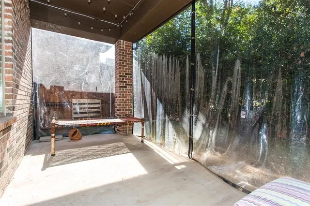 a view of sitting area with furniture and wooden fence