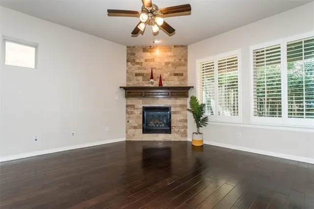 a view of a livingroom with a fireplace and window