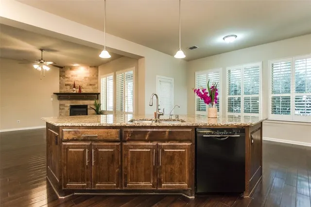 a kitchen with a sink and cabinets
