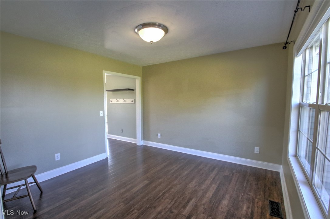 4998 Wayne Road Mantua, OH 44255 - Photo 16 of 43 dining room with dark hardwood / wood-style floors