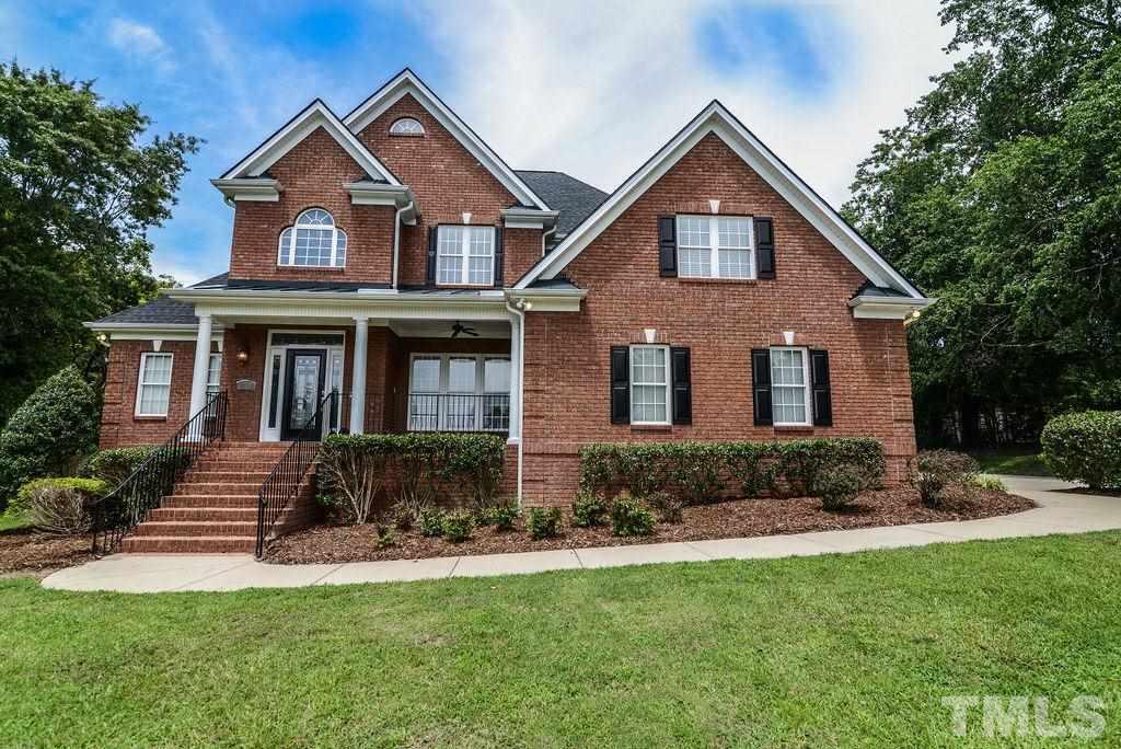 1308 Pagan Road Raleigh, NC 27603 - Photo 1 of 30 a front view of a house with a yard and garage