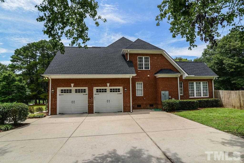 1308 Pagan Road Raleigh, NC 27603 - Photo 4 of 30 a front view of a house with a garden