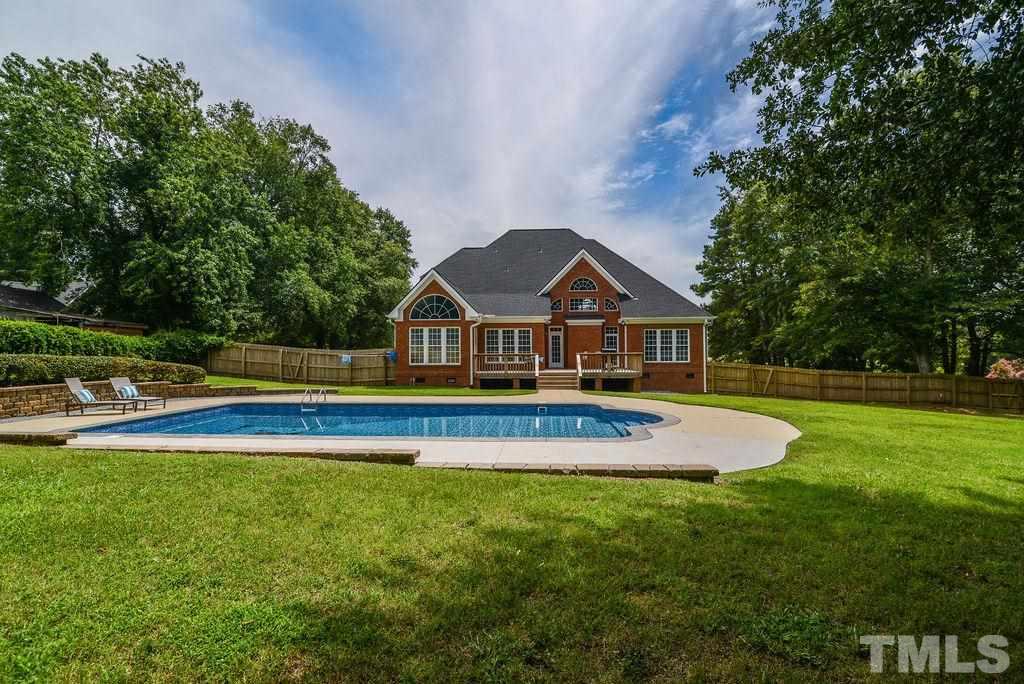 1308 Pagan Road Raleigh, NC 27603 - Photo 5 of 30 a front view of house with yard and swimming pool