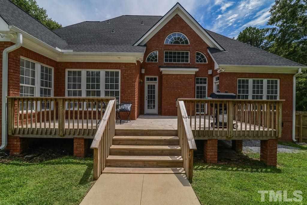 1308 Pagan Road Raleigh, NC 27603 - Photo 7 of 30 a view of a brick house with brick walls and a large windows