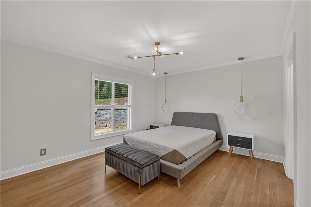 4610 West Morton Road Alpharetta, GA 30022 - Photo 21 of 53 a living room with a bed furniture and a window