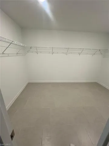 a bathroom with a double vanity sink and mirror