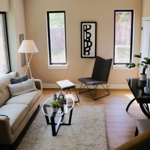 322 South School Street, Unit 322 Mount Prospect, IL 60056 - Photo 6 of 10 a living room with furniture and a lamp
