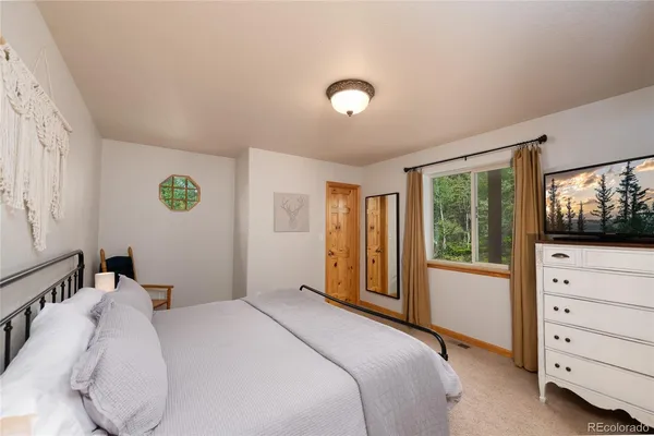 a bedroom with a bed and a walk in closet