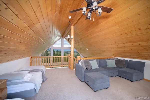 a living room with furniture a fireplace and a table