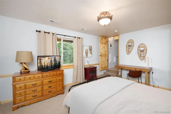 a room with painting and a table