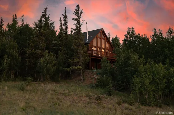 a living room with furniture and large window