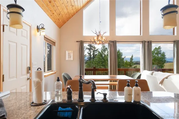 a bedroom with furniture and large windows
