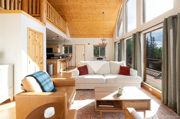 a kitchen with stainless steel appliances granite countertop a refrigerator a stove a sink a microwave and wooden cabinets