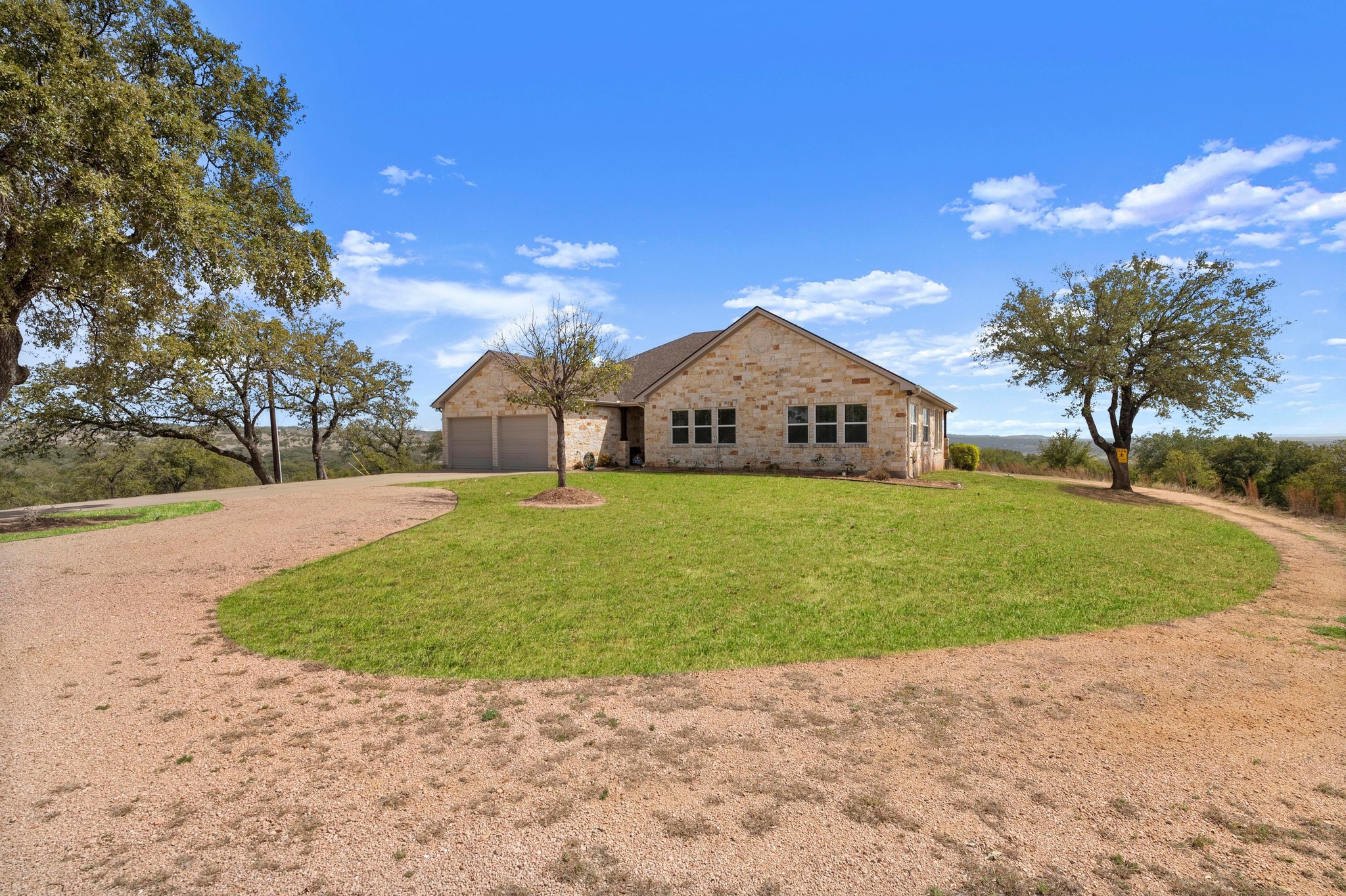 28701 Valley Road Marble Falls, TX 78654 - Photo 4 of 35 a view of a house with a yard