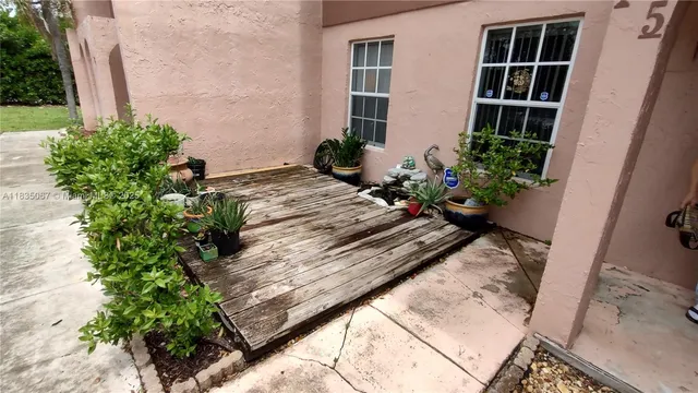 a vase of flowers sitting on a floor