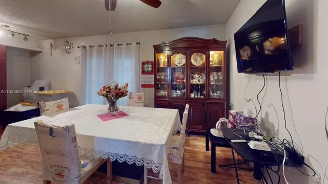 a dining room with furniture and window