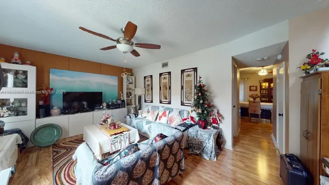 a living room with furniture a dining table and a fireplace