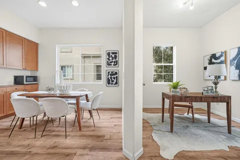 a view of a dining room with furniture window and outside view
