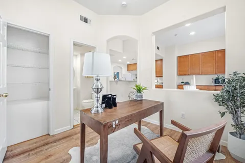 a view of a dining room with furniture and wooden floor