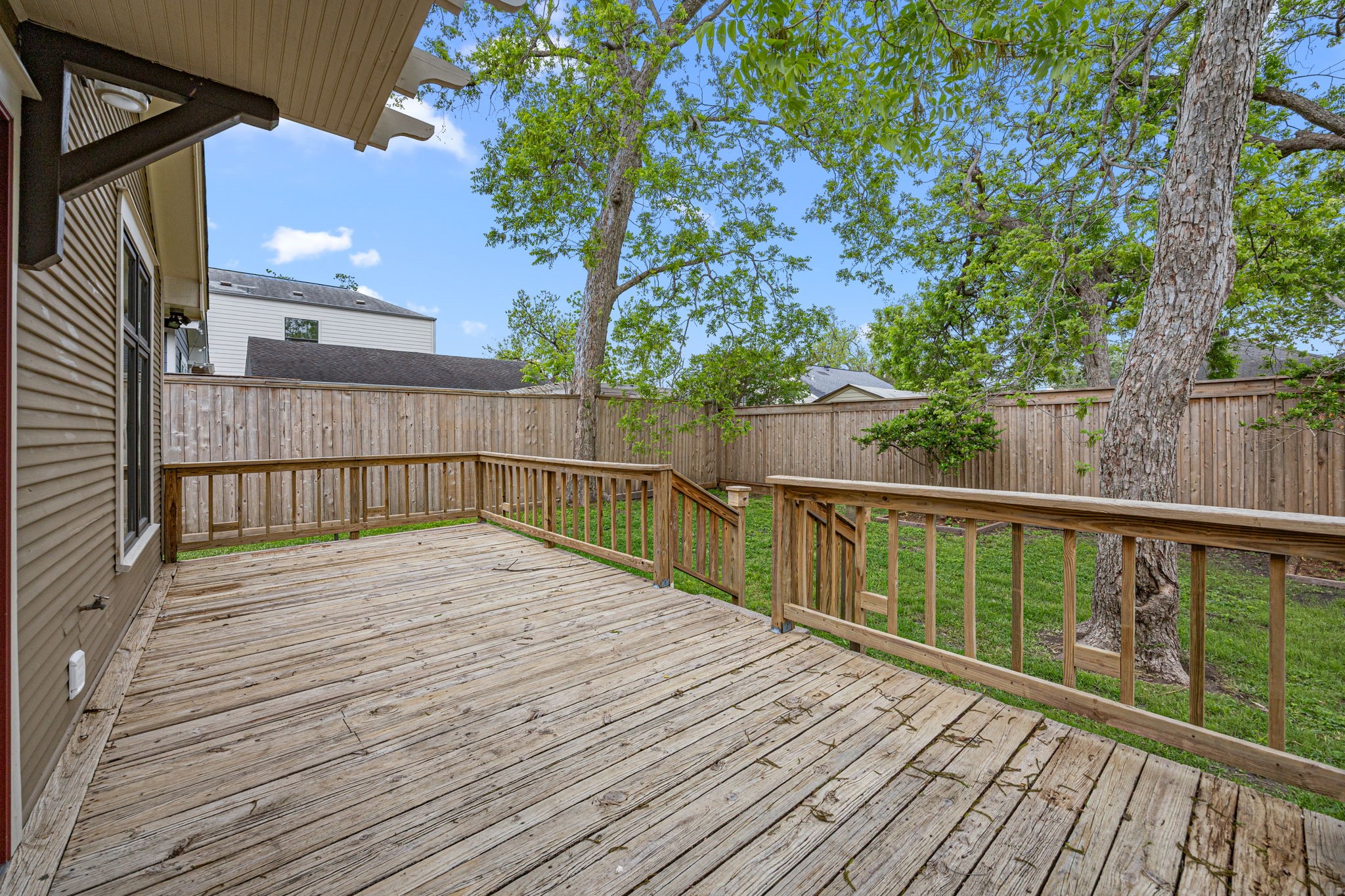 1115 Adele Street Houston, TX 77009 - Photo 15 of 19 Spacious wood deck perfect for entertaining, dining, or relaxing outdoors.
