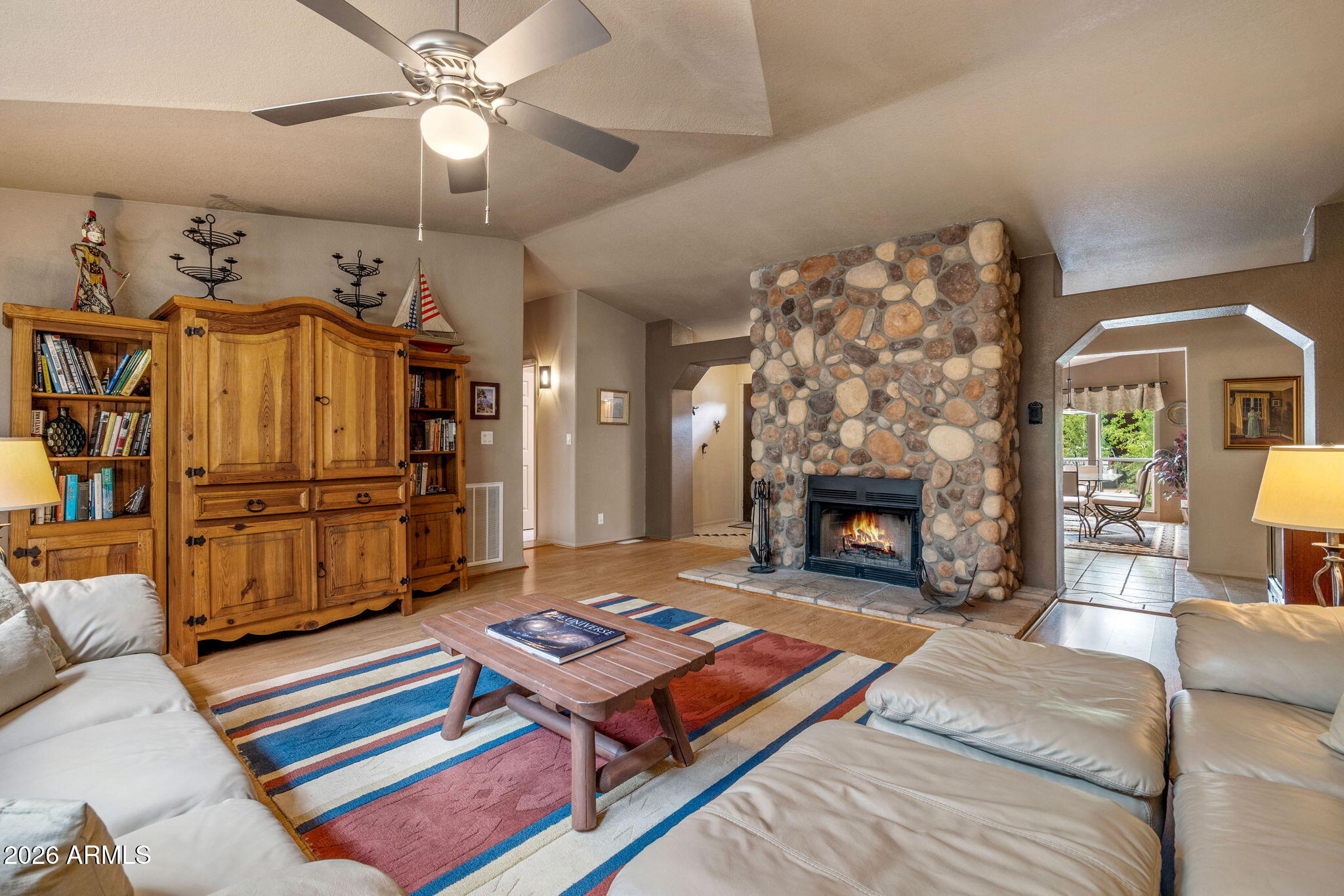 758 Southlake Road Lakeside, AZ 85929 - Photo 61 of 95 a living room with furniture a flat screen tv and a fireplace