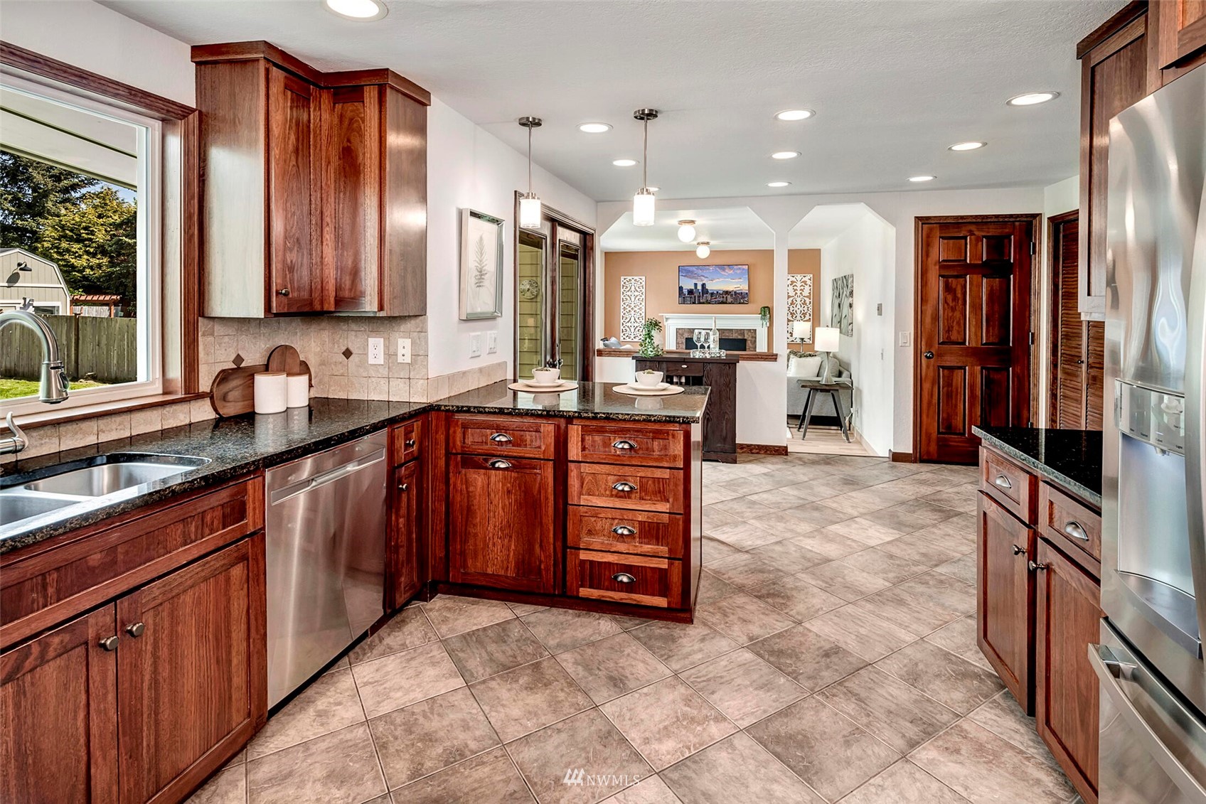 23413 12th Place West Bothell, WA 98021 - Photo 11 of 39 a kitchen with stainless steel appliances a sink stove and cabinets