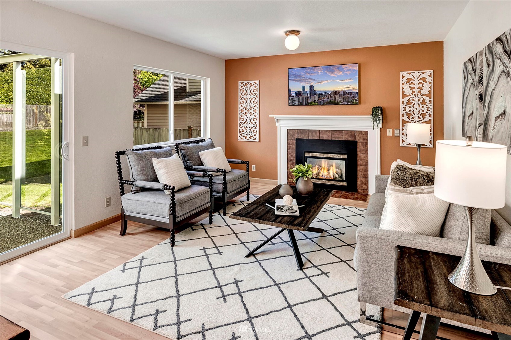 23413 12th Place West Bothell, WA 98021 - Photo 13 of 39 a living room with furniture a flat screen tv and a fireplace