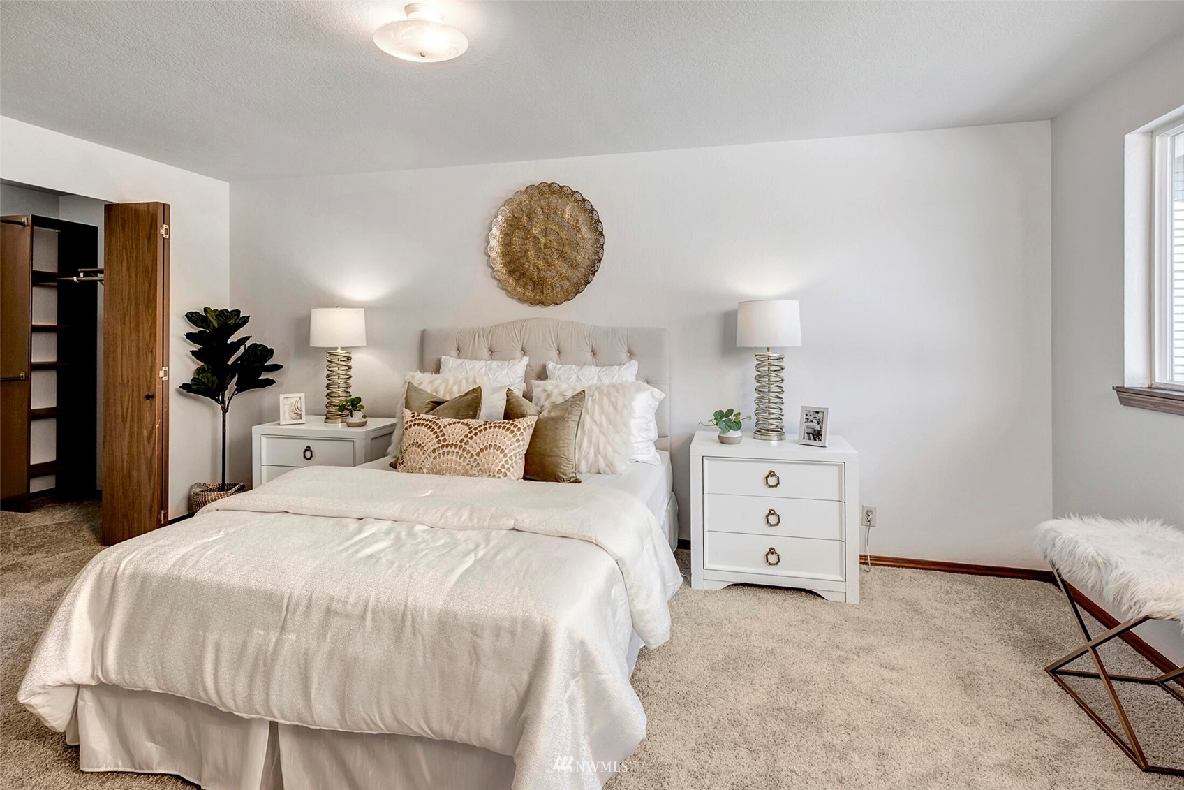 23413 12th Place West Bothell, WA 98021 - Photo 18 of 39 a bedroom with a bed and a chandelier
