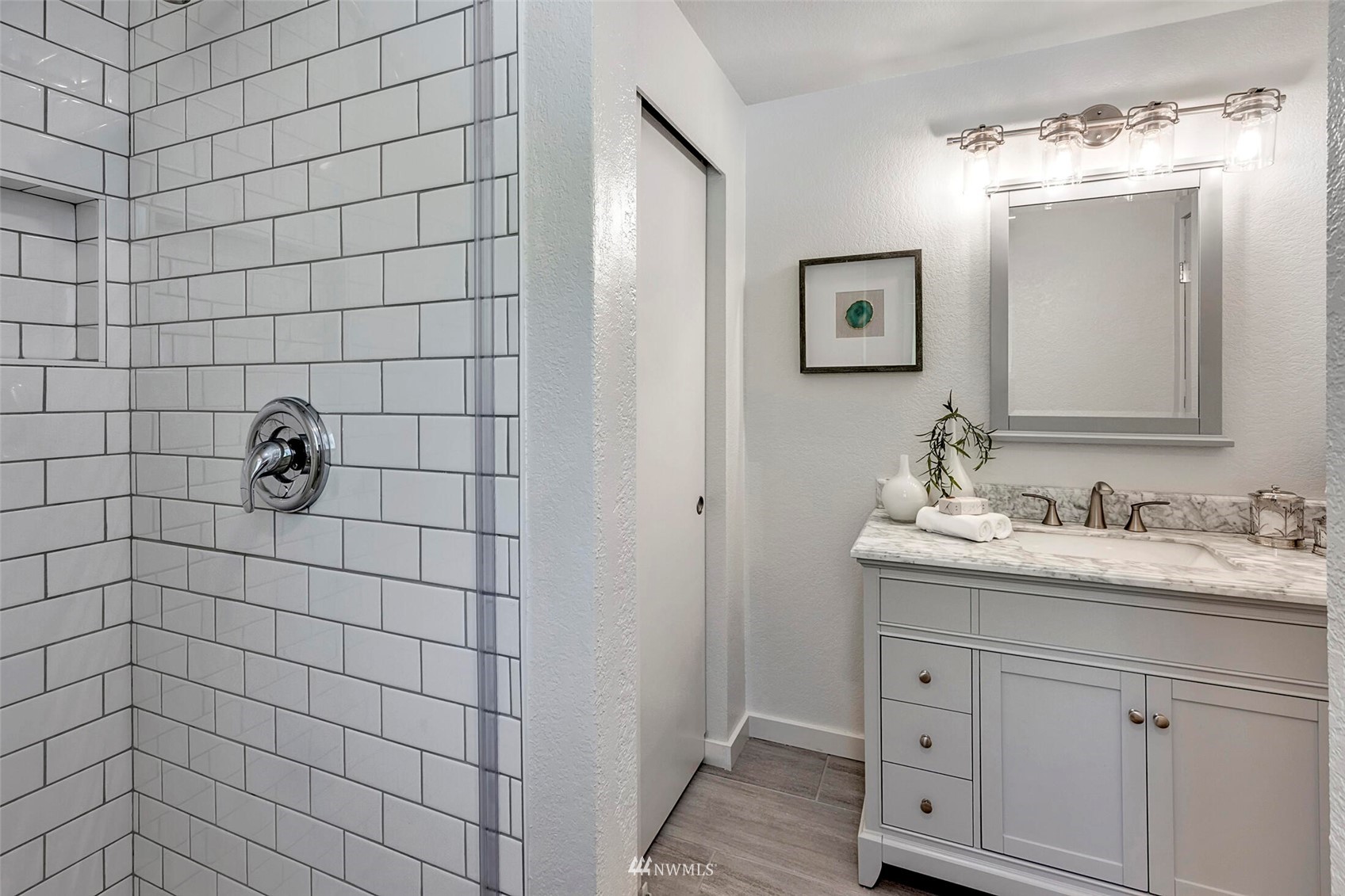 23413 12th Place West Bothell, WA 98021 - Photo 19 of 39 a bathroom with a sink a toilet and mirror