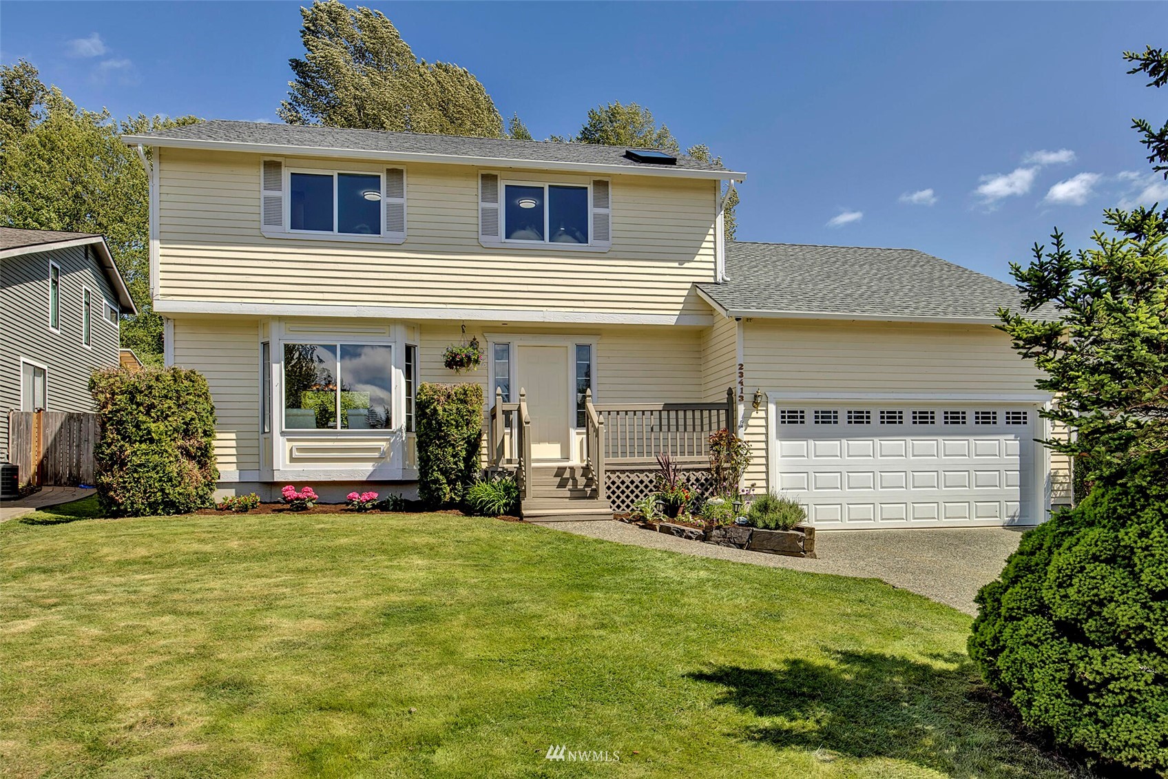 23413 12th Place West Bothell, WA 98021 - Photo 2 of 39 a front view of a house with a yard