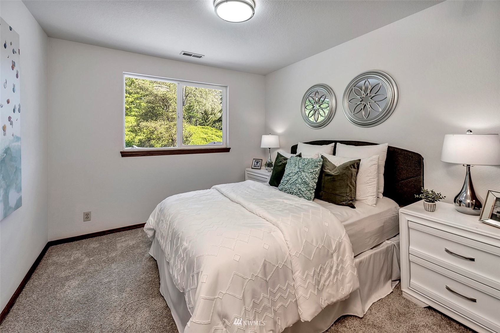 23413 12th Place West Bothell, WA 98021 - Photo 21 of 39 a bedroom with a bed and a lamp on table
