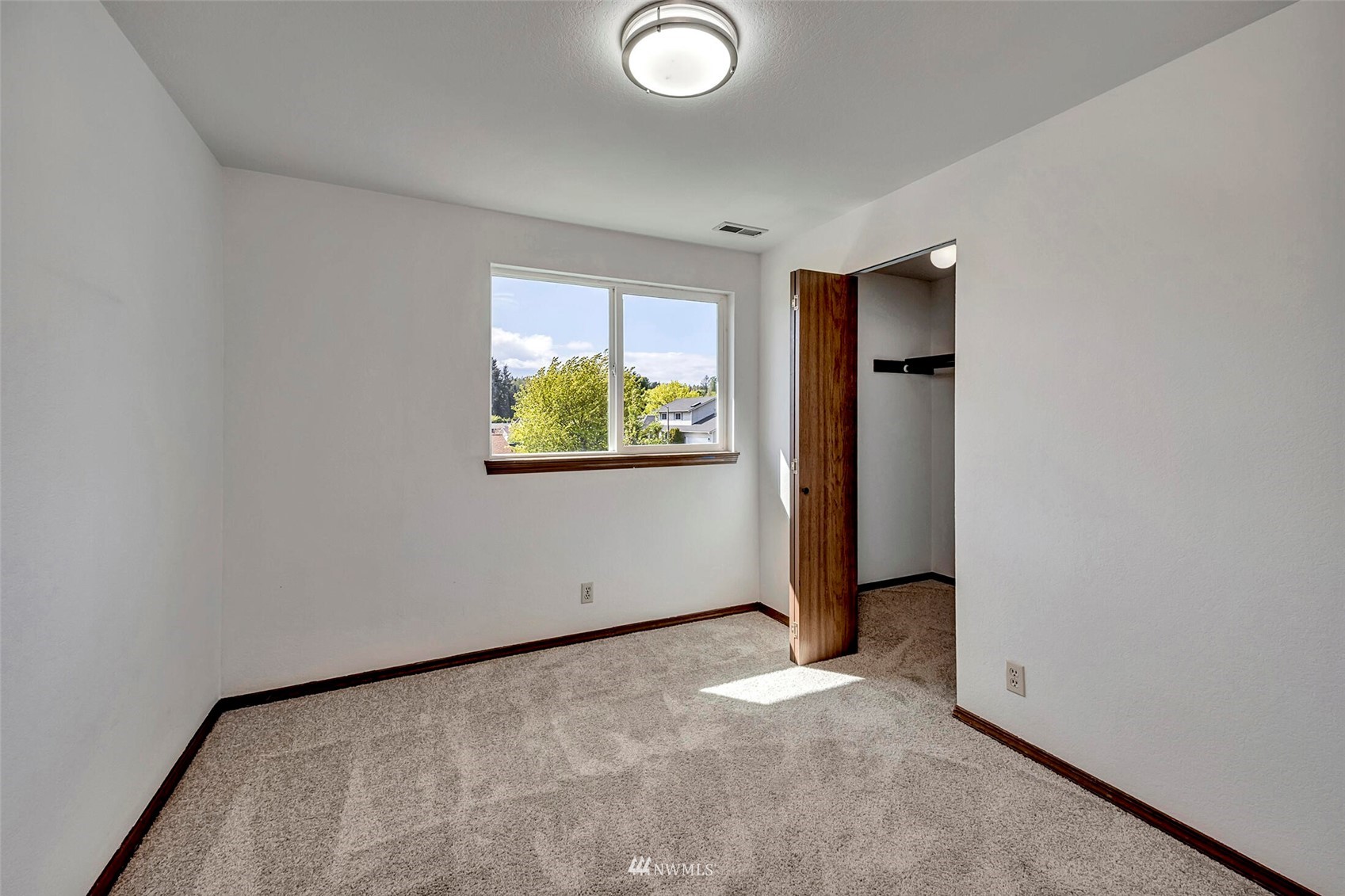 23413 12th Place West Bothell, WA 98021 - Photo 23 of 39 an empty room with windows and closet