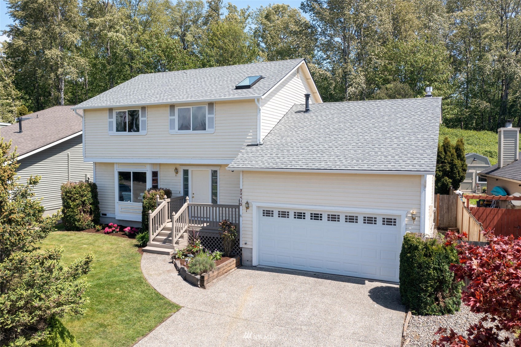 23413 12th Place West Bothell, WA 98021 - Photo 33 of 39 a view of a house with sitting area and garden