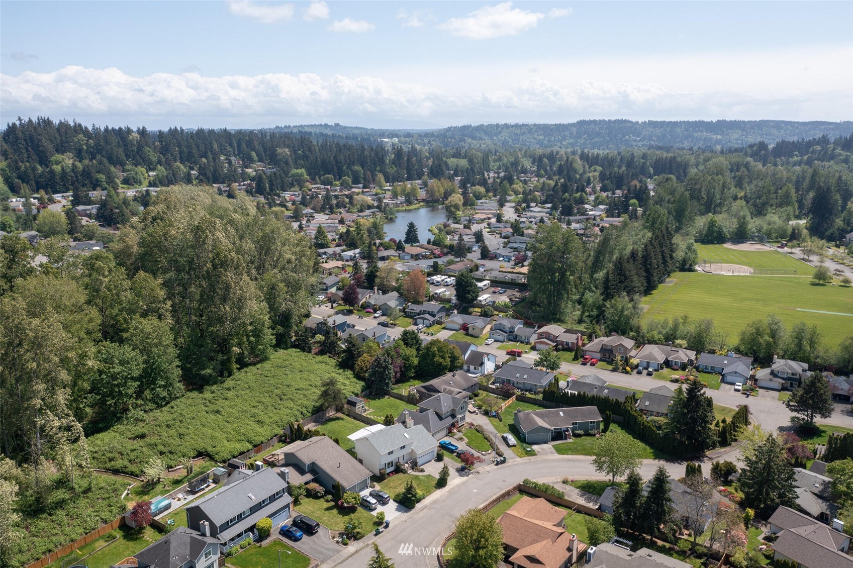 23413 12th Place West Bothell, WA 98021 - Photo 36 of 39 an aerial view of residential houses with outdoor space and trees