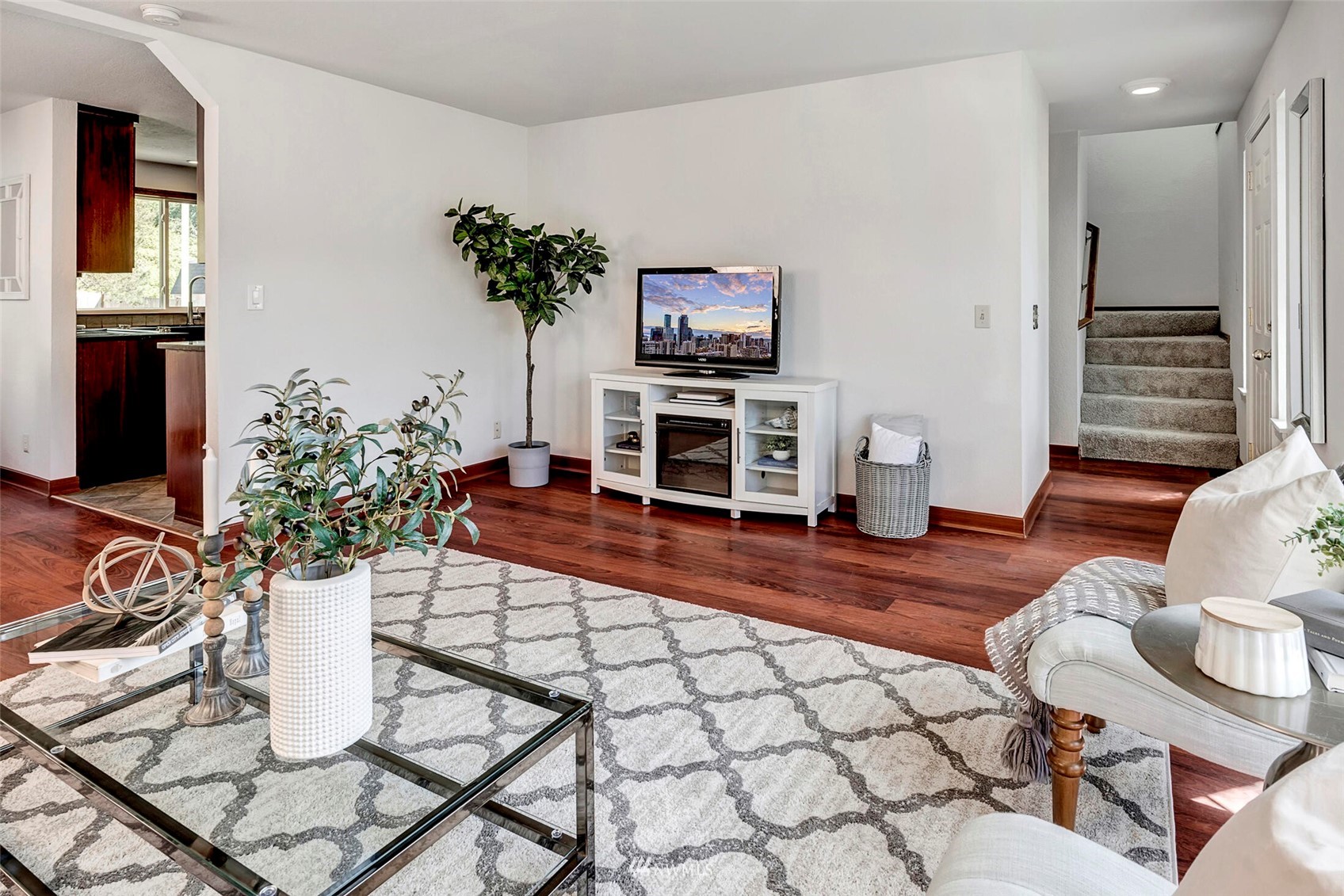 23413 12th Place West Bothell, WA 98021 - Photo 5 of 39 a living room with furniture a flat screen tv and a table