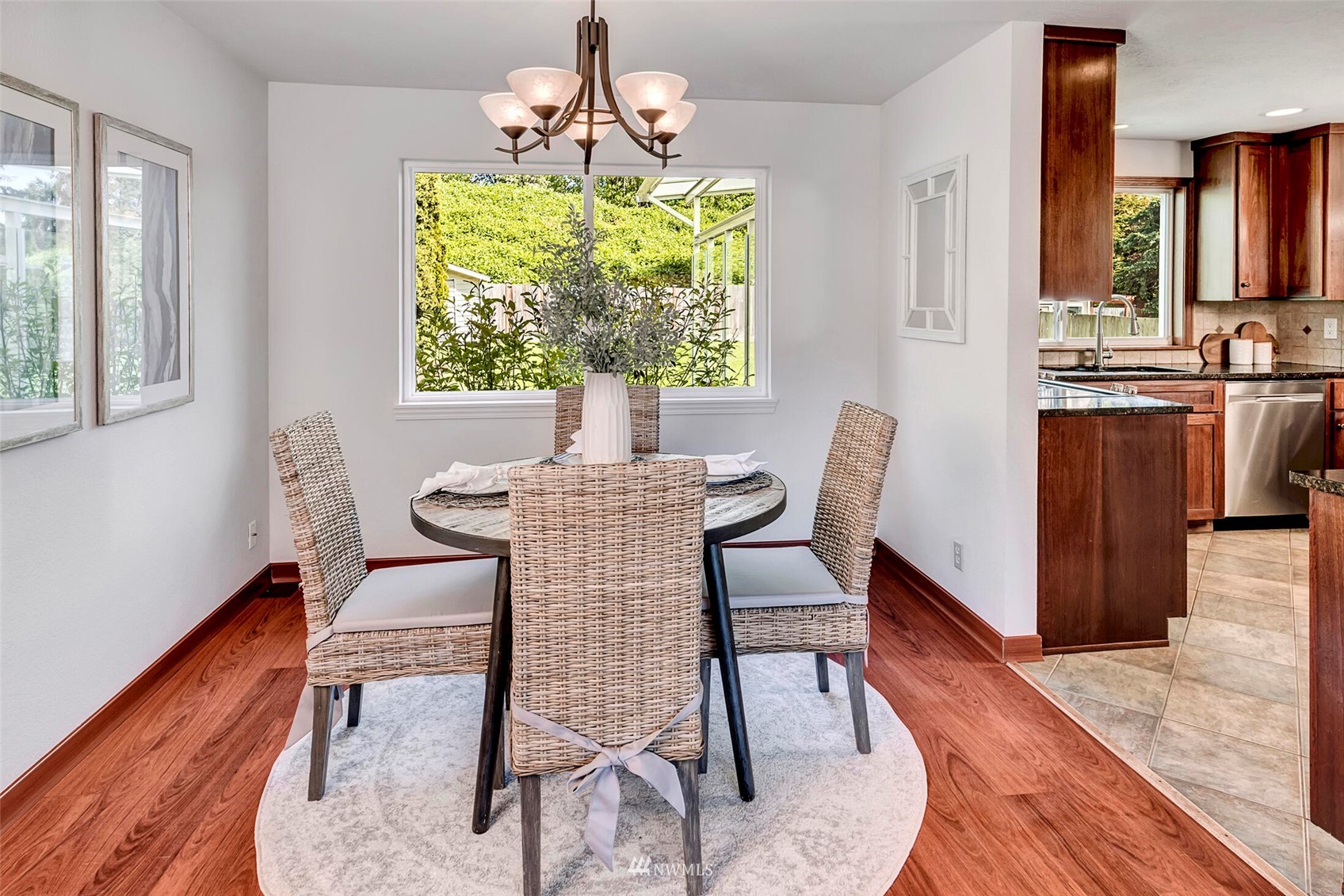 23413 12th Place West Bothell, WA 98021 - Photo 6 of 39 a dining room with furniture a chandelier and wooden floor