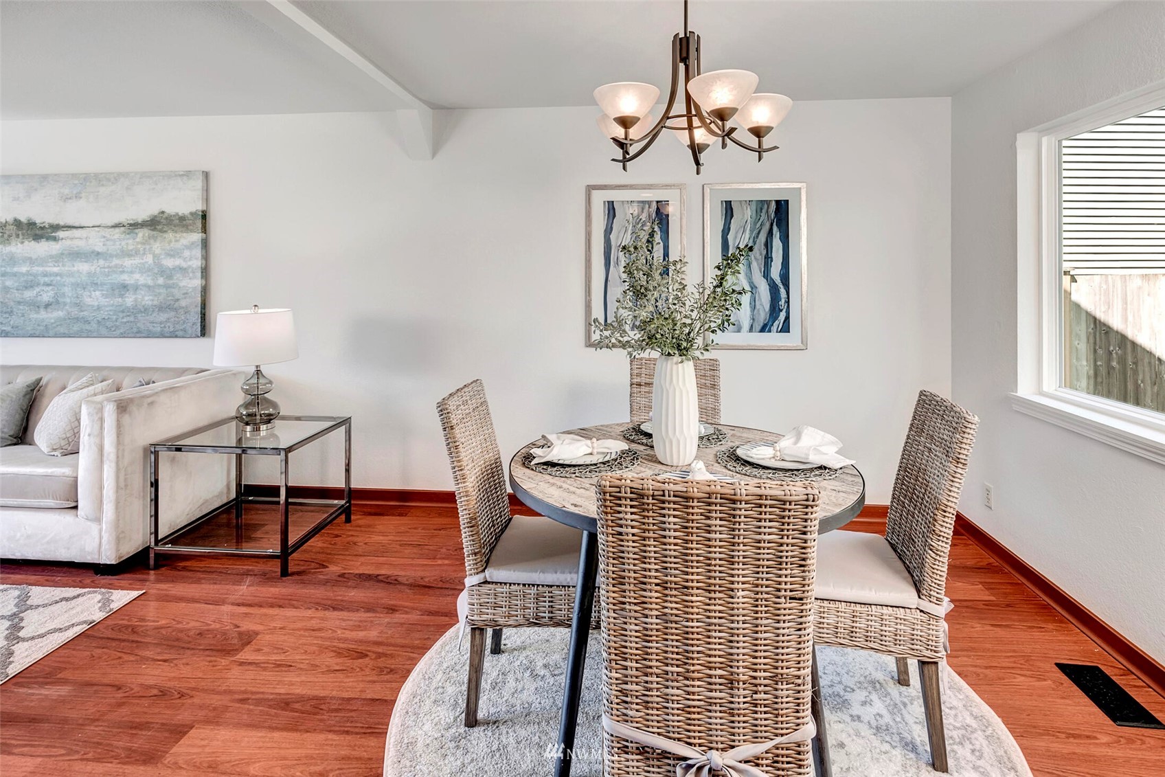 23413 12th Place West Bothell, WA 98021 - Photo 7 of 39 a dining room with wooden floor a chandelier a glass table and chairs