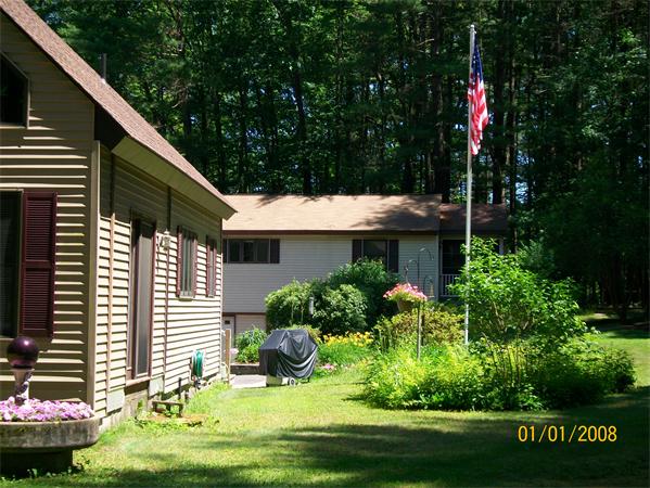 6 Pine Valley Road Northampton, MA 01062 - Photo 1 of 30 a backyard of a house with lots of green space